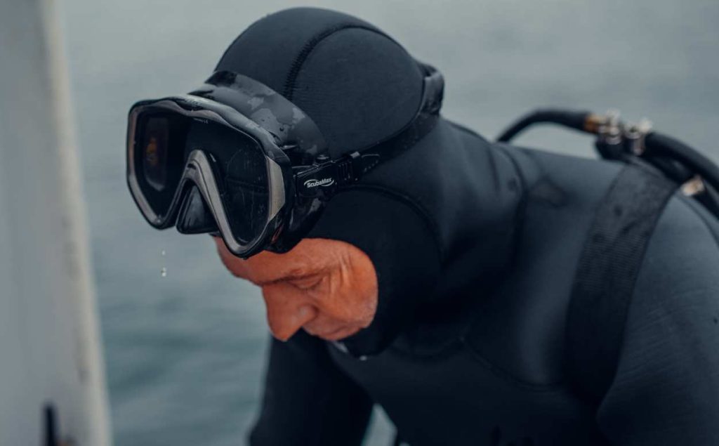 older scuba diver in a wetsuit